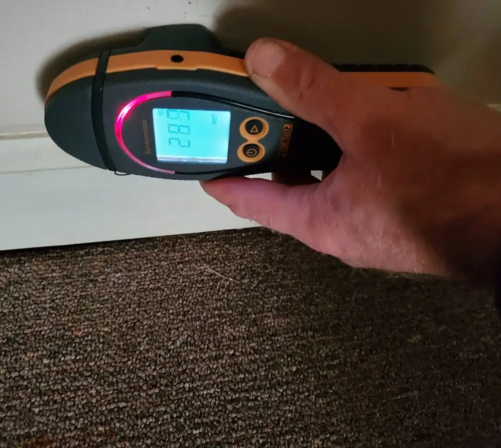 Moisture detection at baseboard during Storm Damage Restoration in Glen Burnie